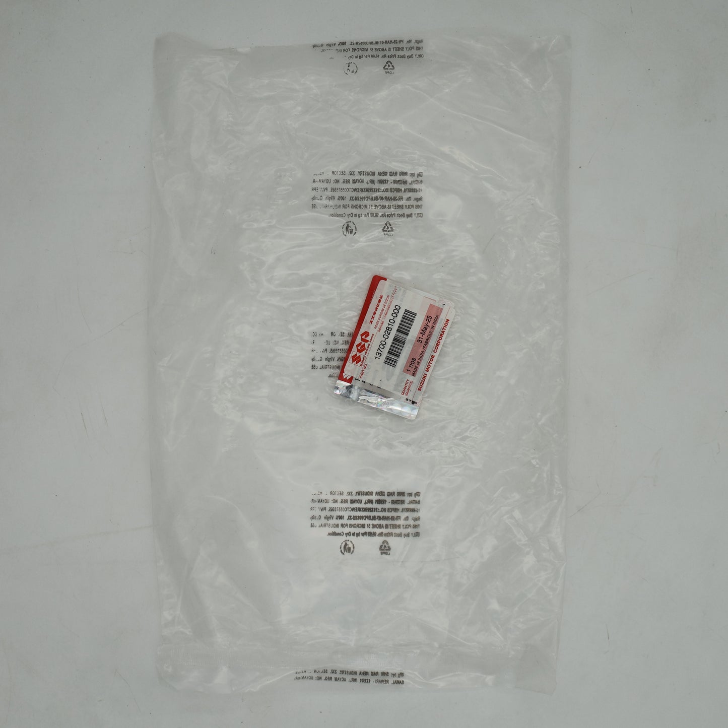 Clear plastic bag with a small red and white label on a gray background