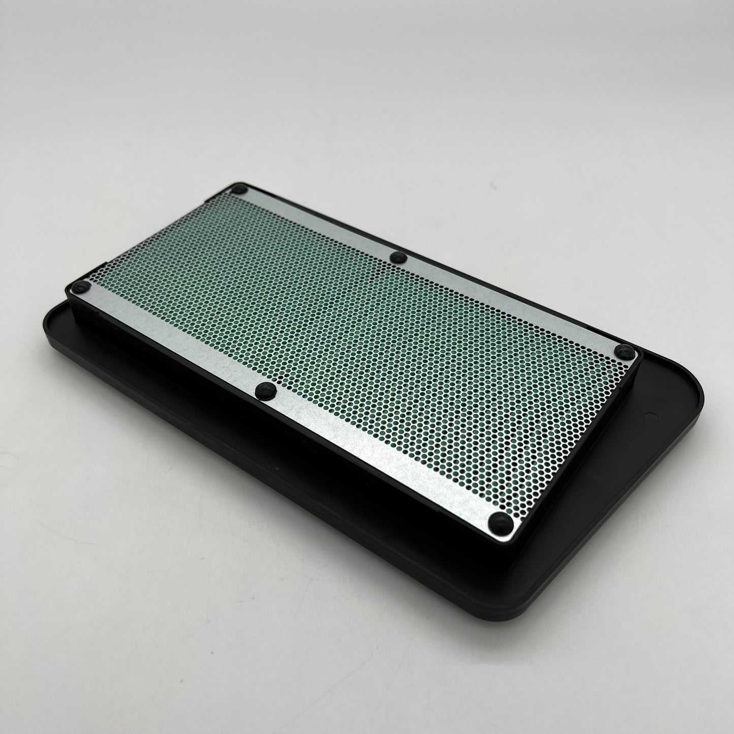 Metallic cooling fin on a gray background
