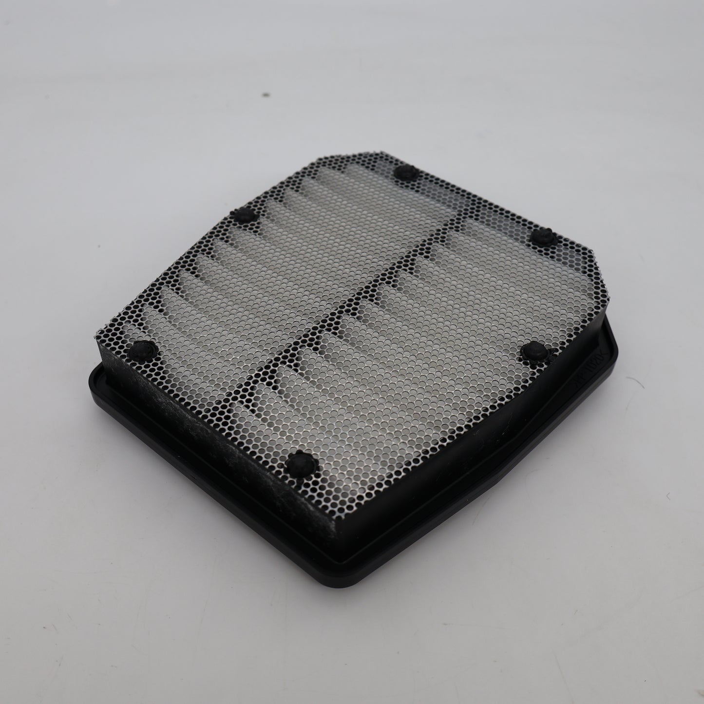 Black honeycomb filter on a white background