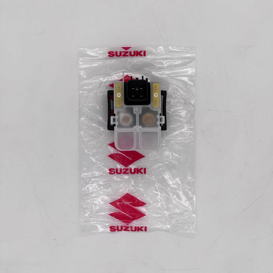 Suzuki car part in clear packaging on a white background