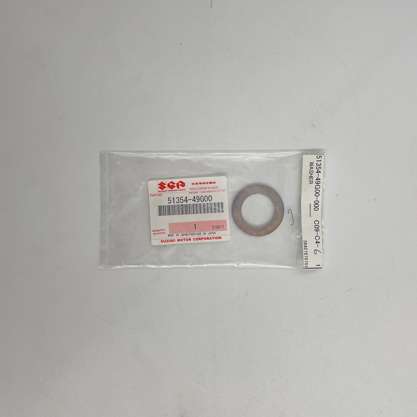 Suzuki washer in clear packaging on a white background