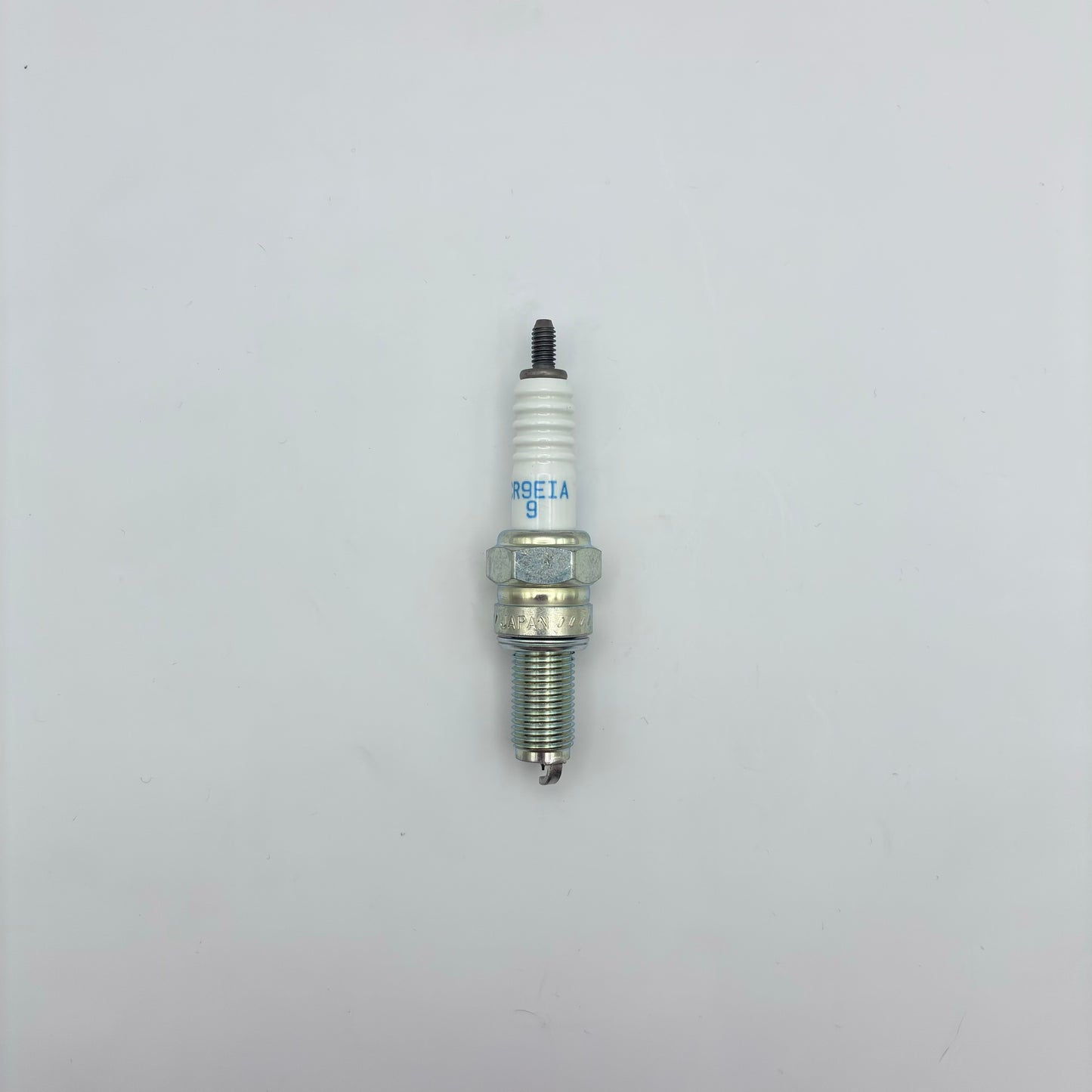 Spark plug on a white background