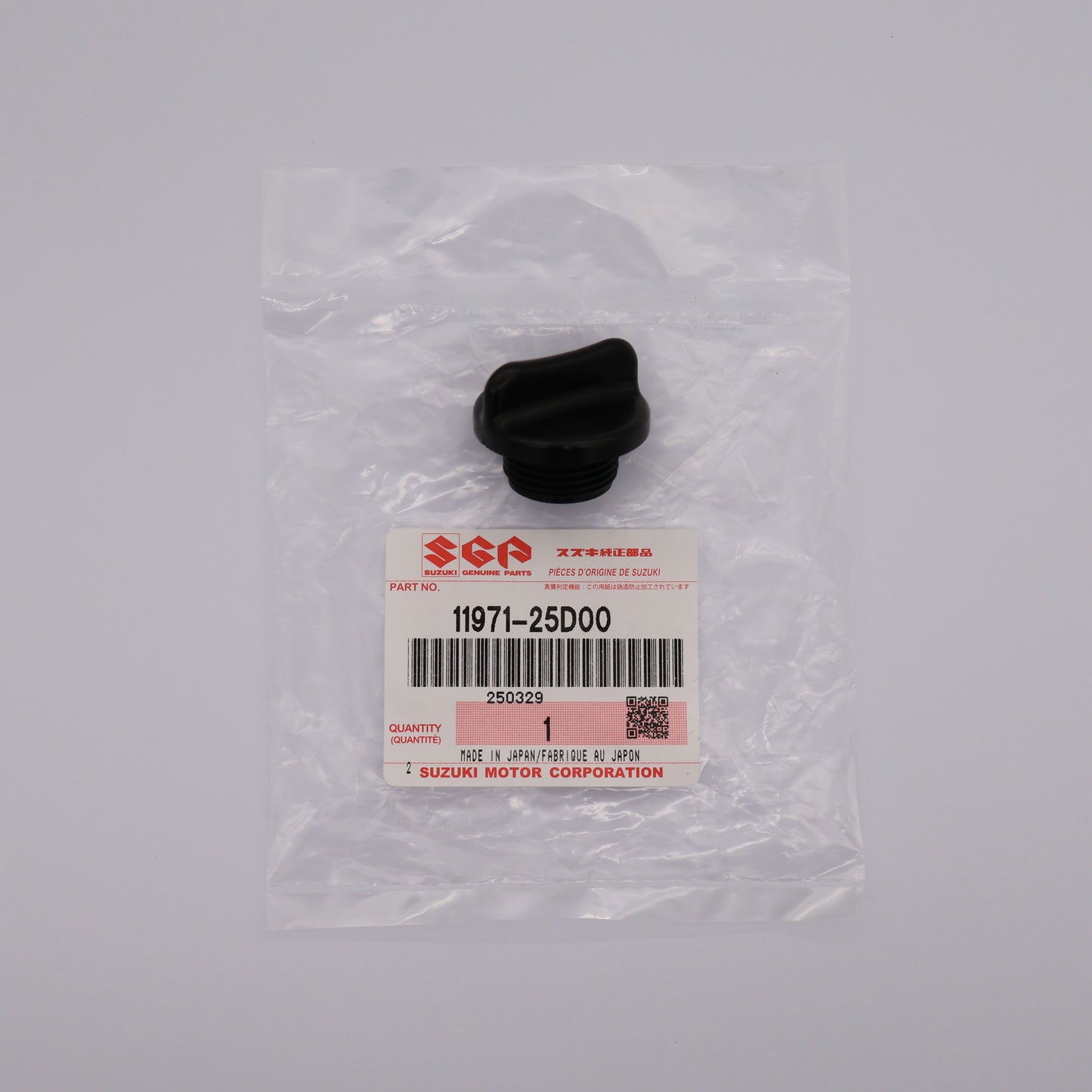 Black rubber part in clear packaging with Suzuki label on a gray background