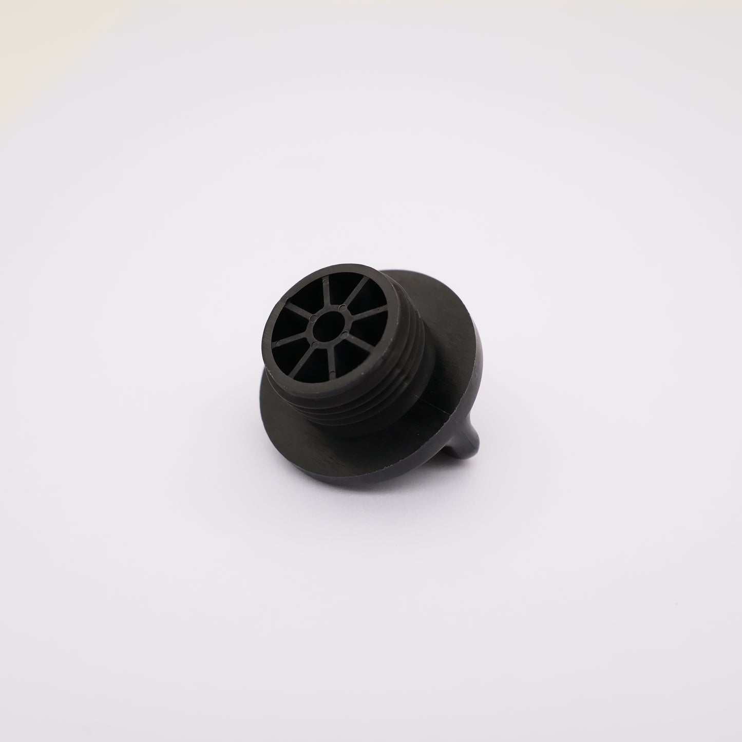 Black rubber grommet on a white background