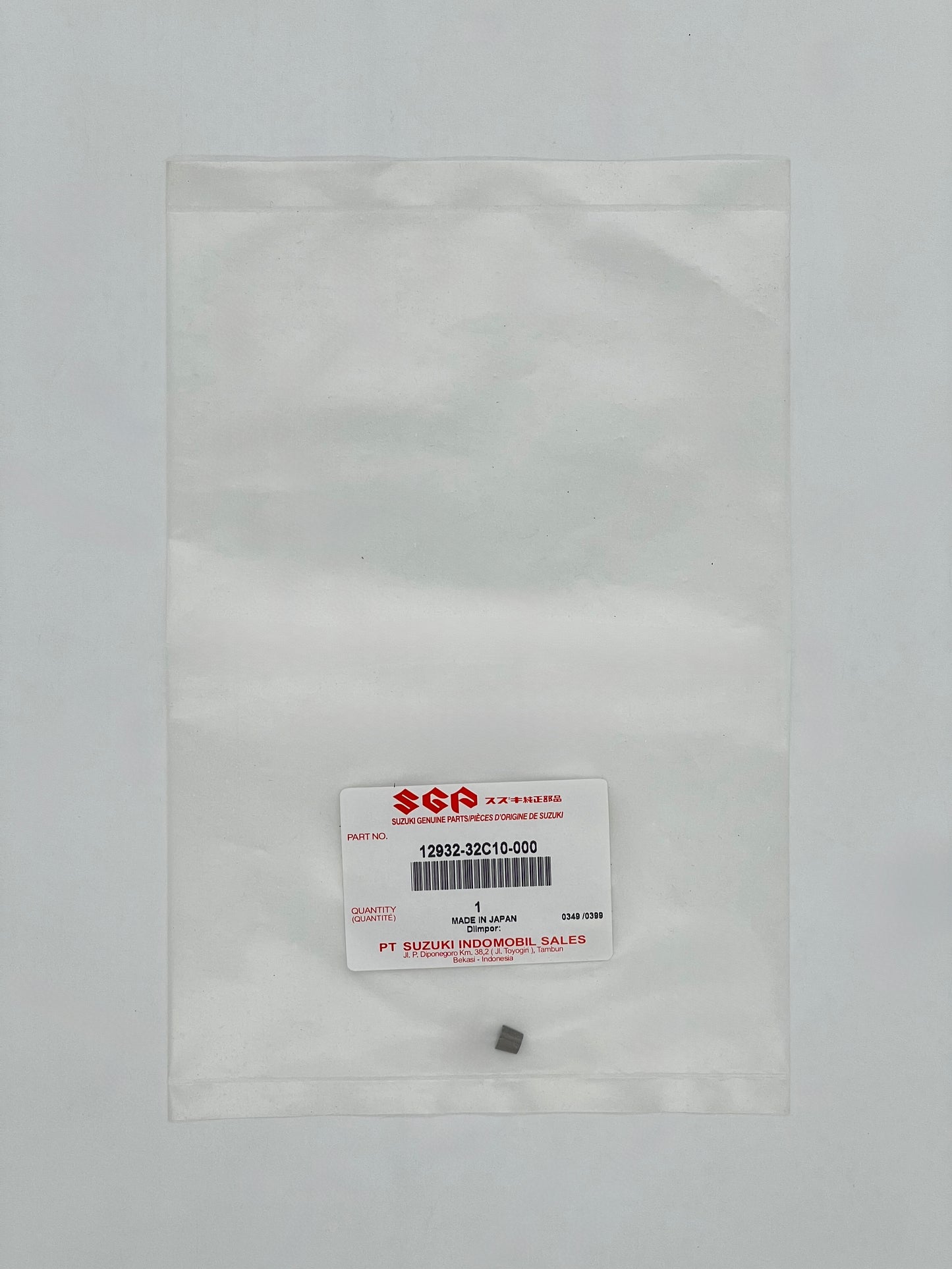 Small gray object inside a clear plastic bag with a SGA label on a light gray background