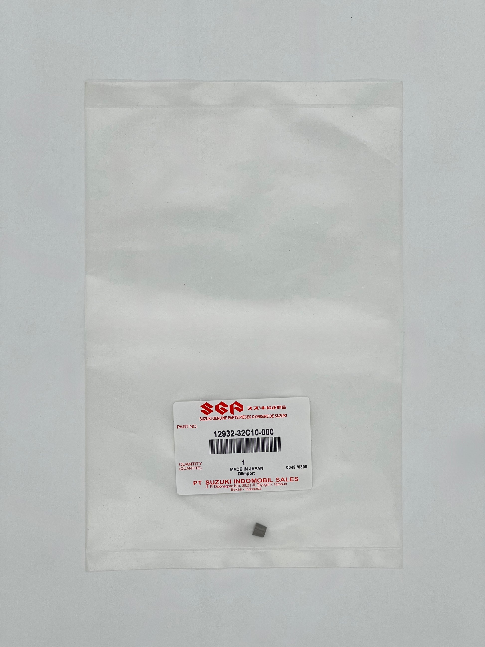 Small gray object inside a clear plastic bag with a SGA label on a light gray background