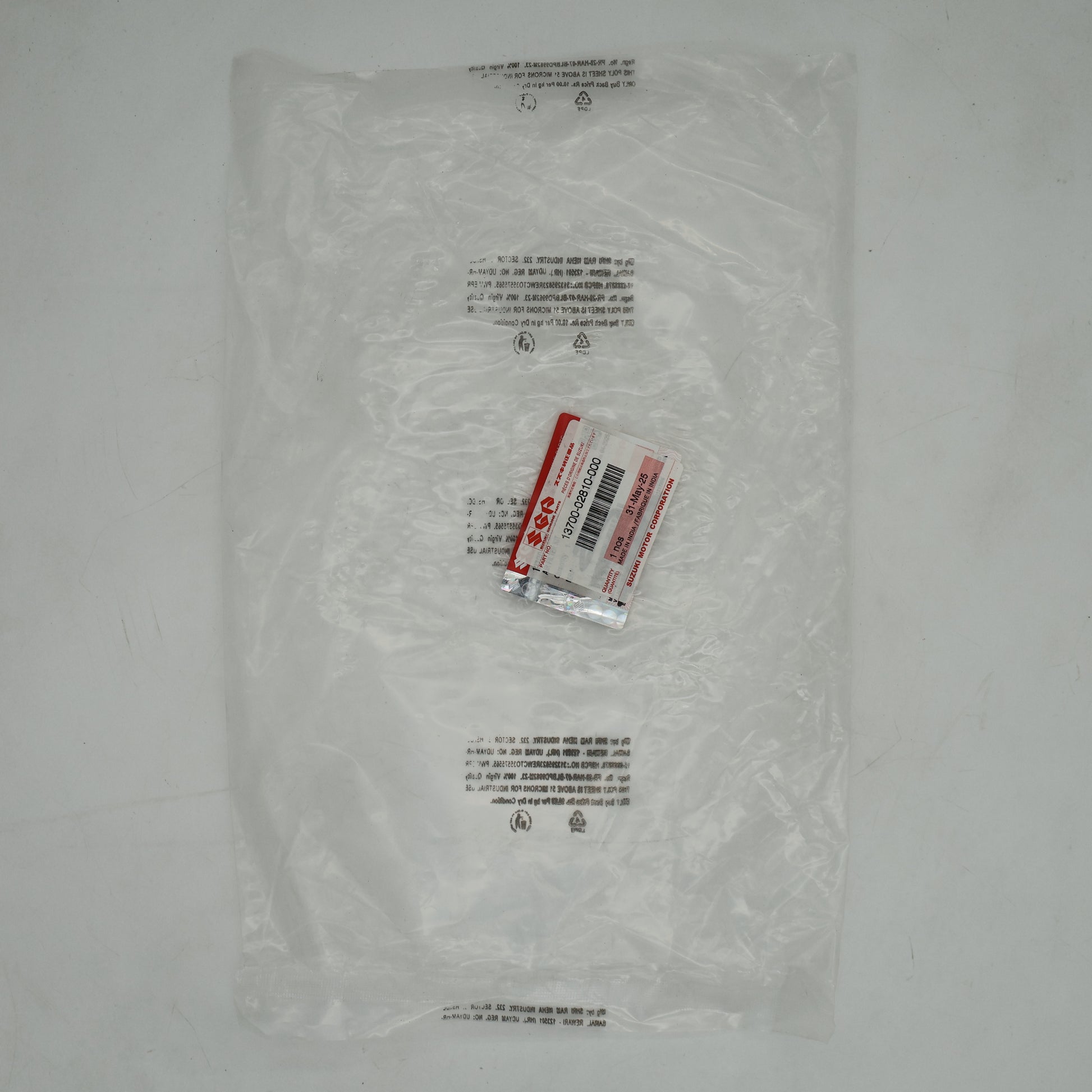 Clear plastic bag with a small red and white label on a gray background