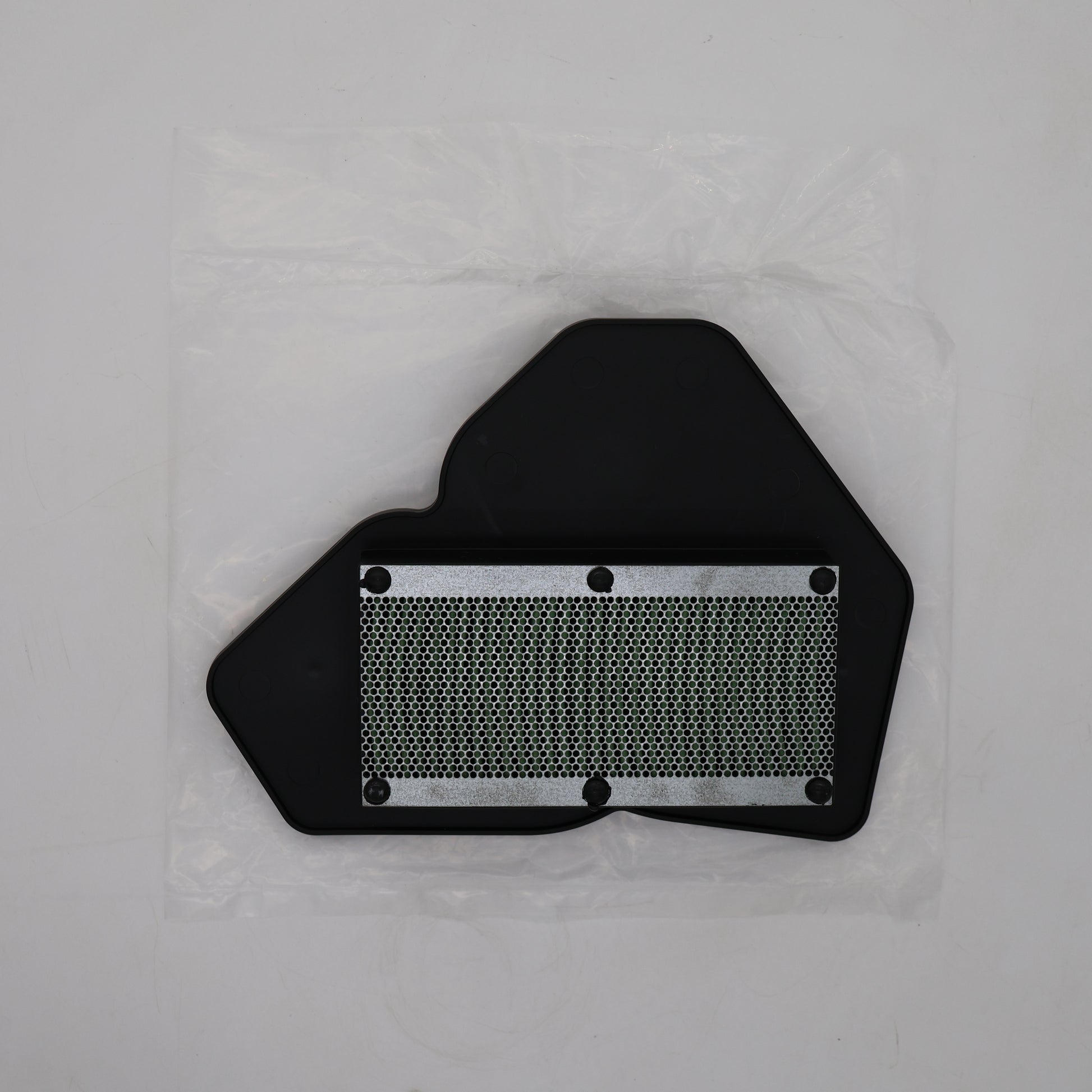 A black plastic automotive part with a silver metal mesh filter section, shown inside a clear plastic protective bag on a light gray background.