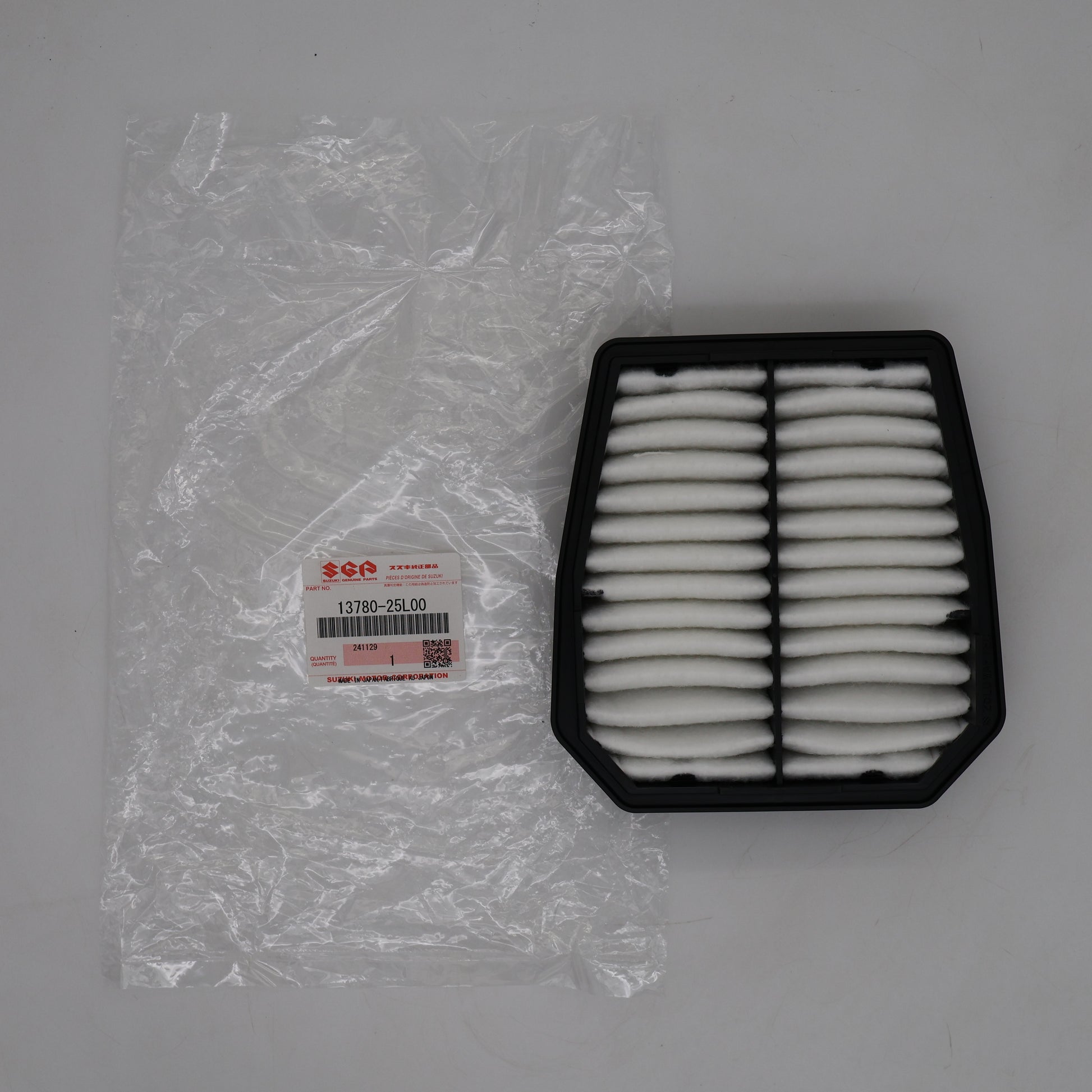 Air filter and packaging on a gray background