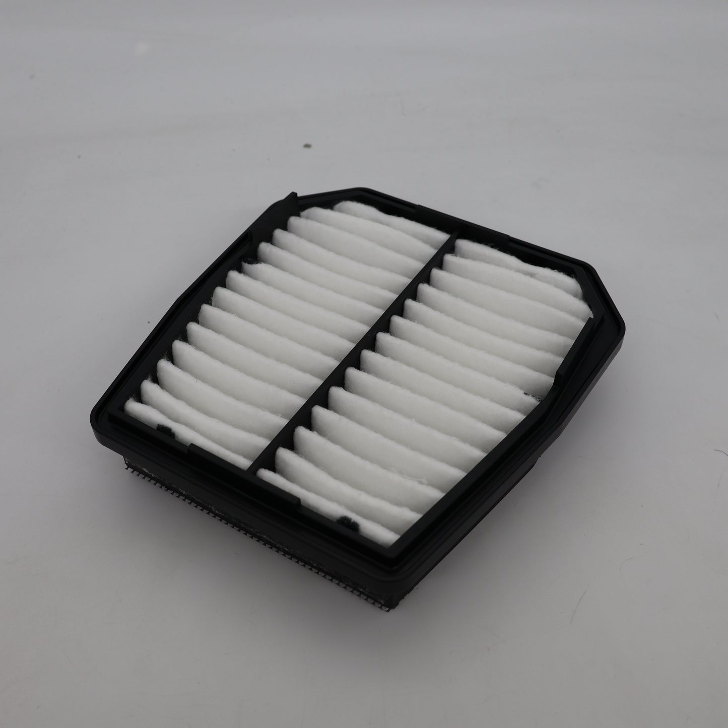 Car air filter on a white background