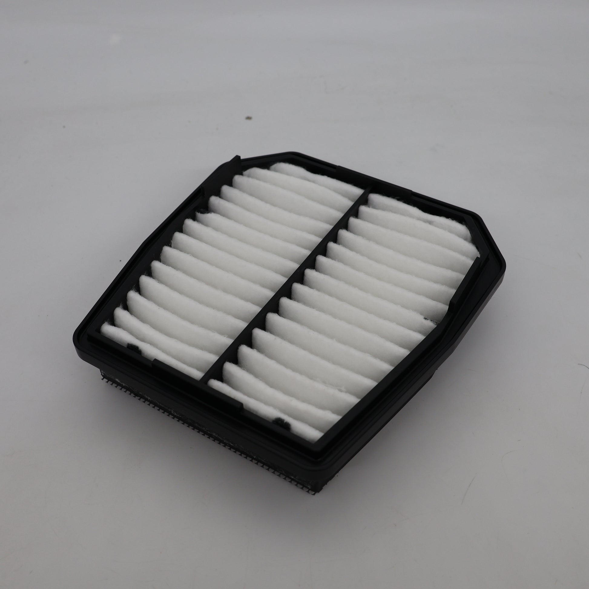 Car air filter on a white background