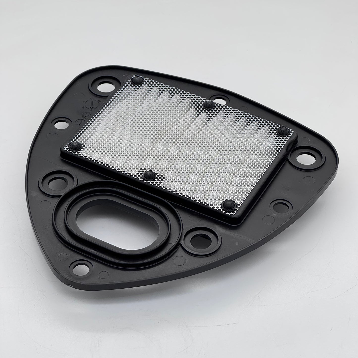 Black metal filter housing with a mesh filter on a white background