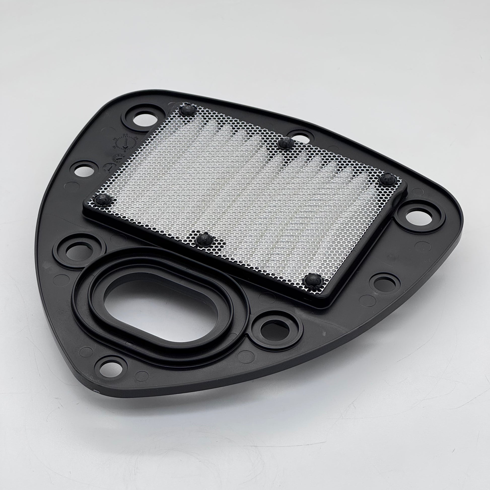 Black metal filter housing with a mesh filter on a white background