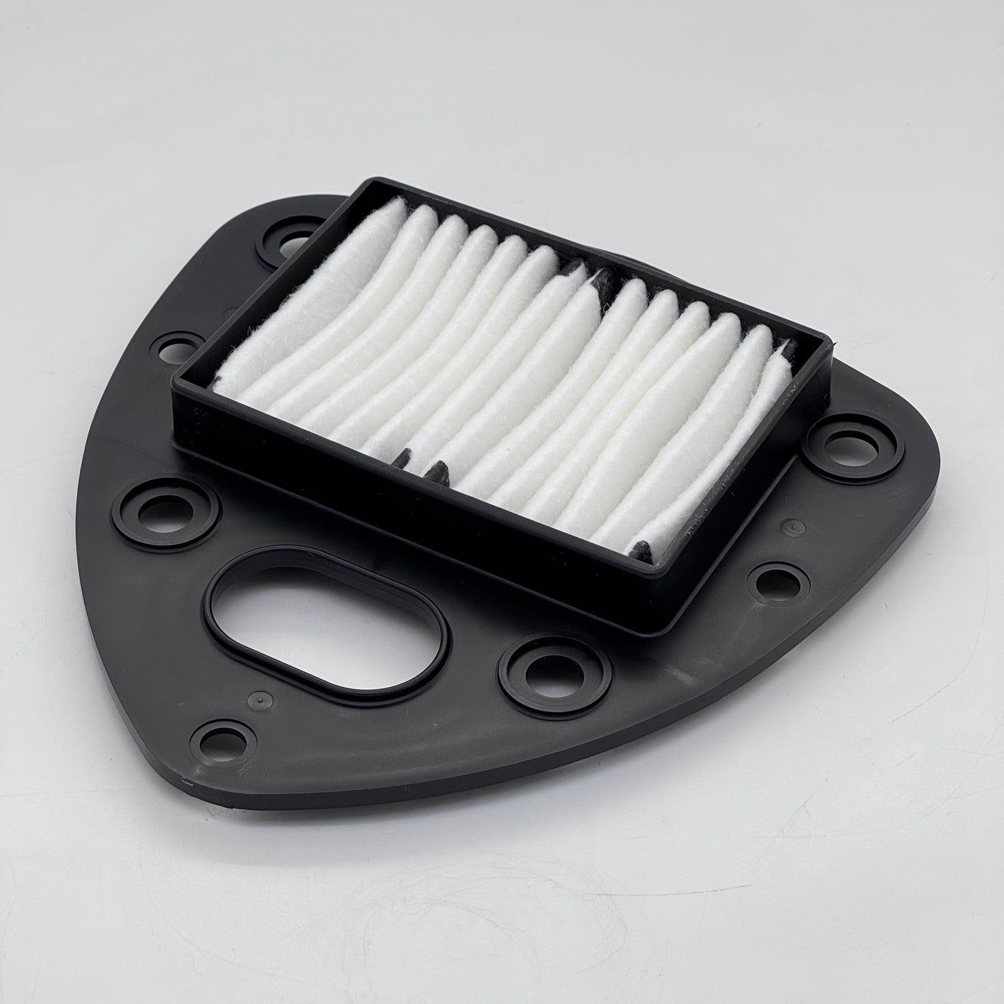Air filter with black housing on a white background