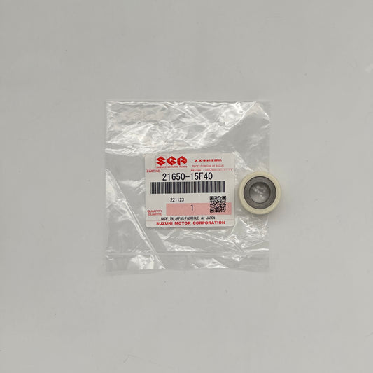 Suzuki part in clear packaging on a gray background