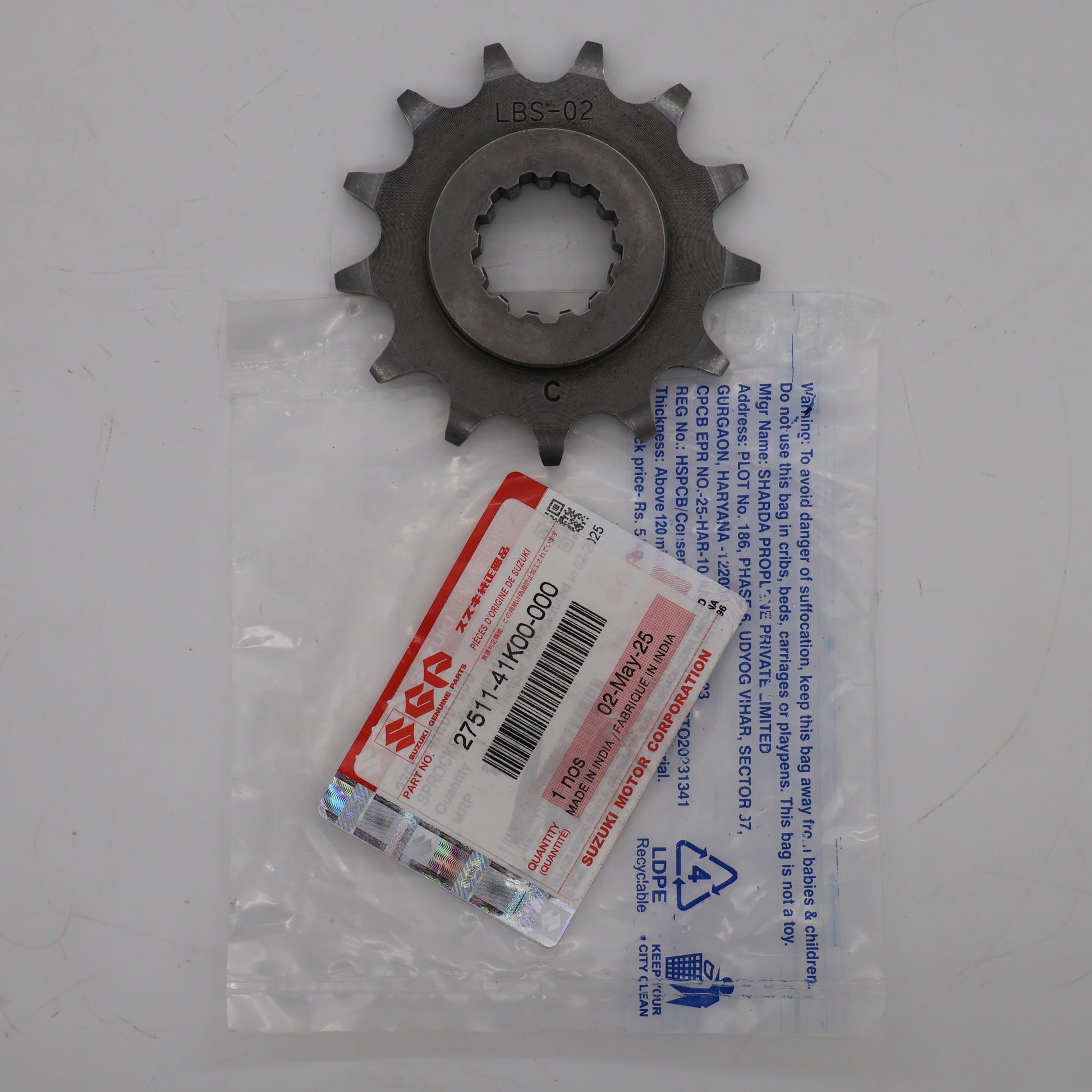 Metal sprocket with a label on a white background