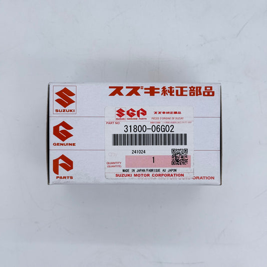 Suzuki parts box with red and white design on a light gray background