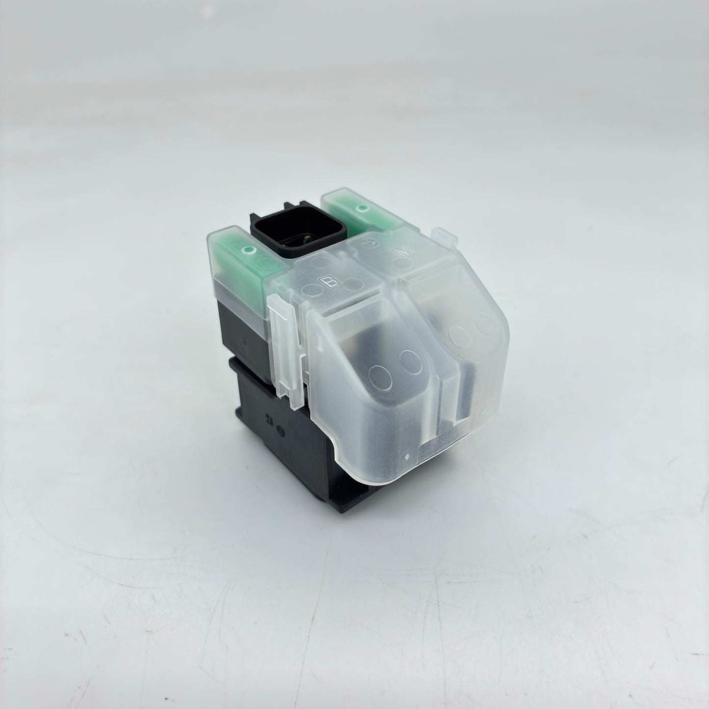 Clear and black mechanical keyboard switch on a white background