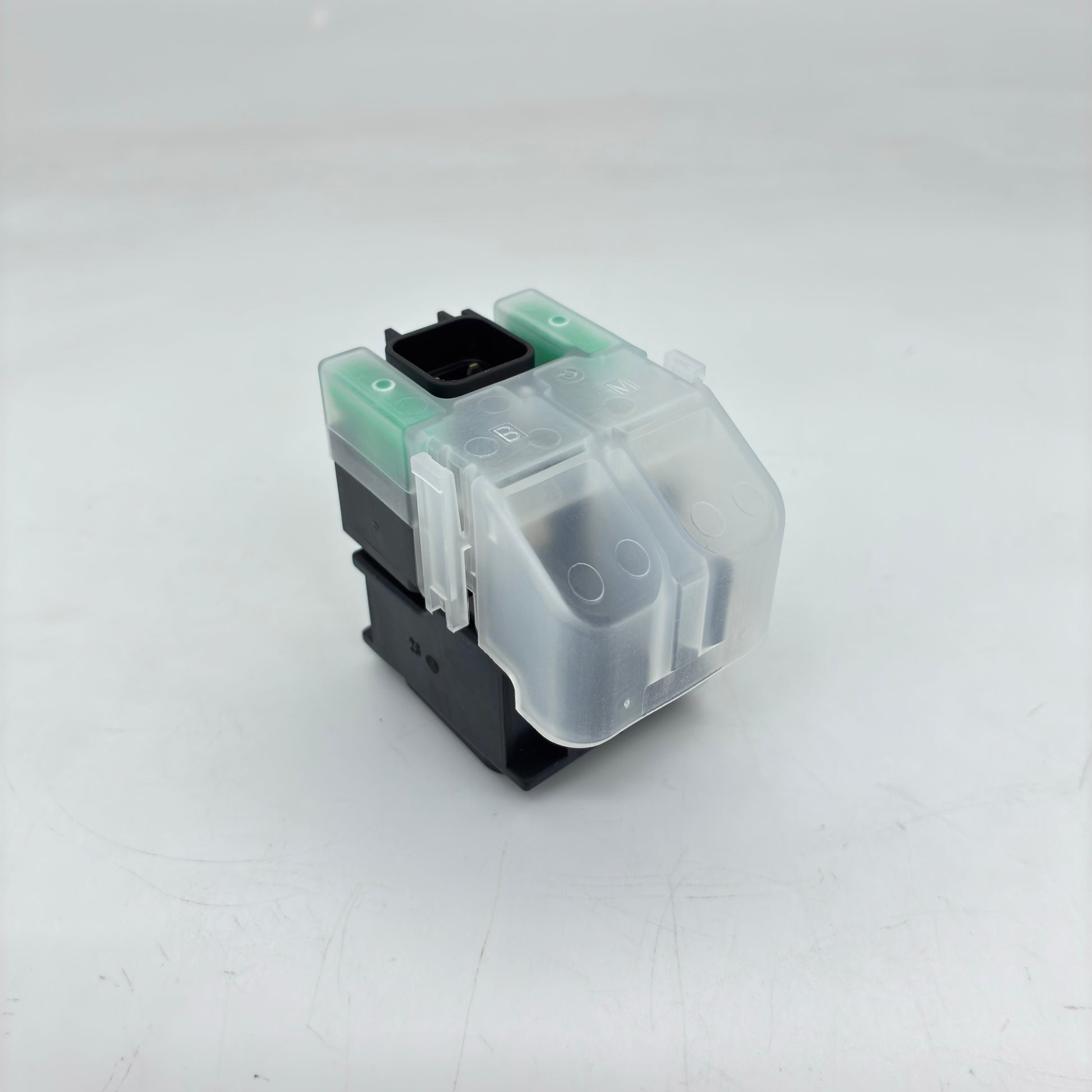 Clear and black mechanical keyboard switch on a white background