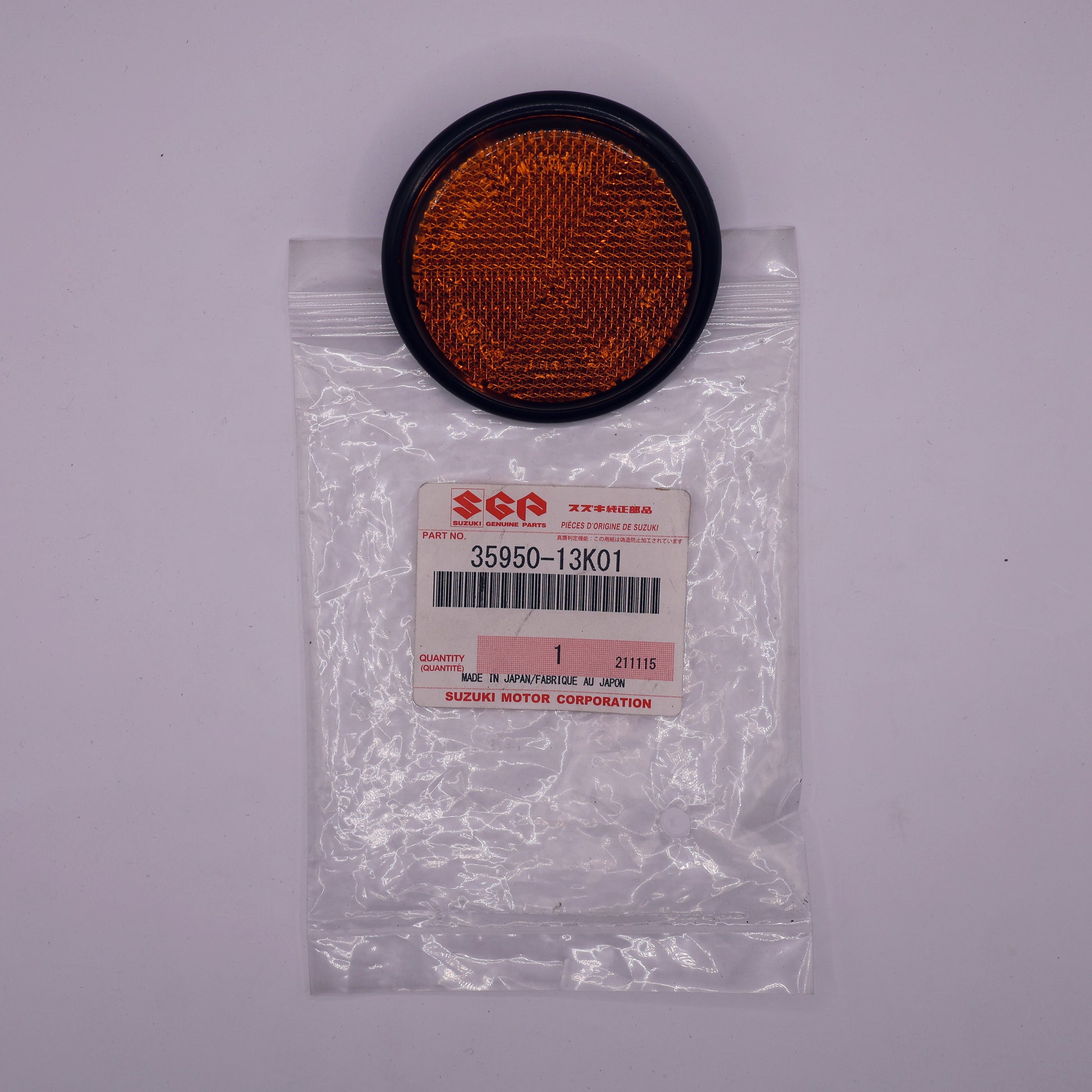 Round orange filter in a clear plastic bag with a label on a white background
