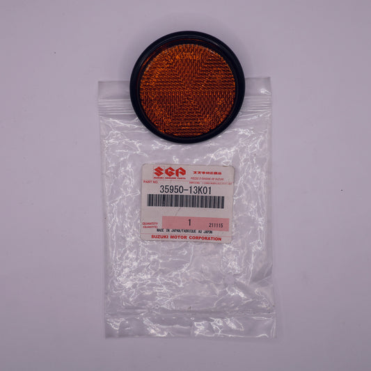 Round orange filter in a clear plastic bag with a label on a white background