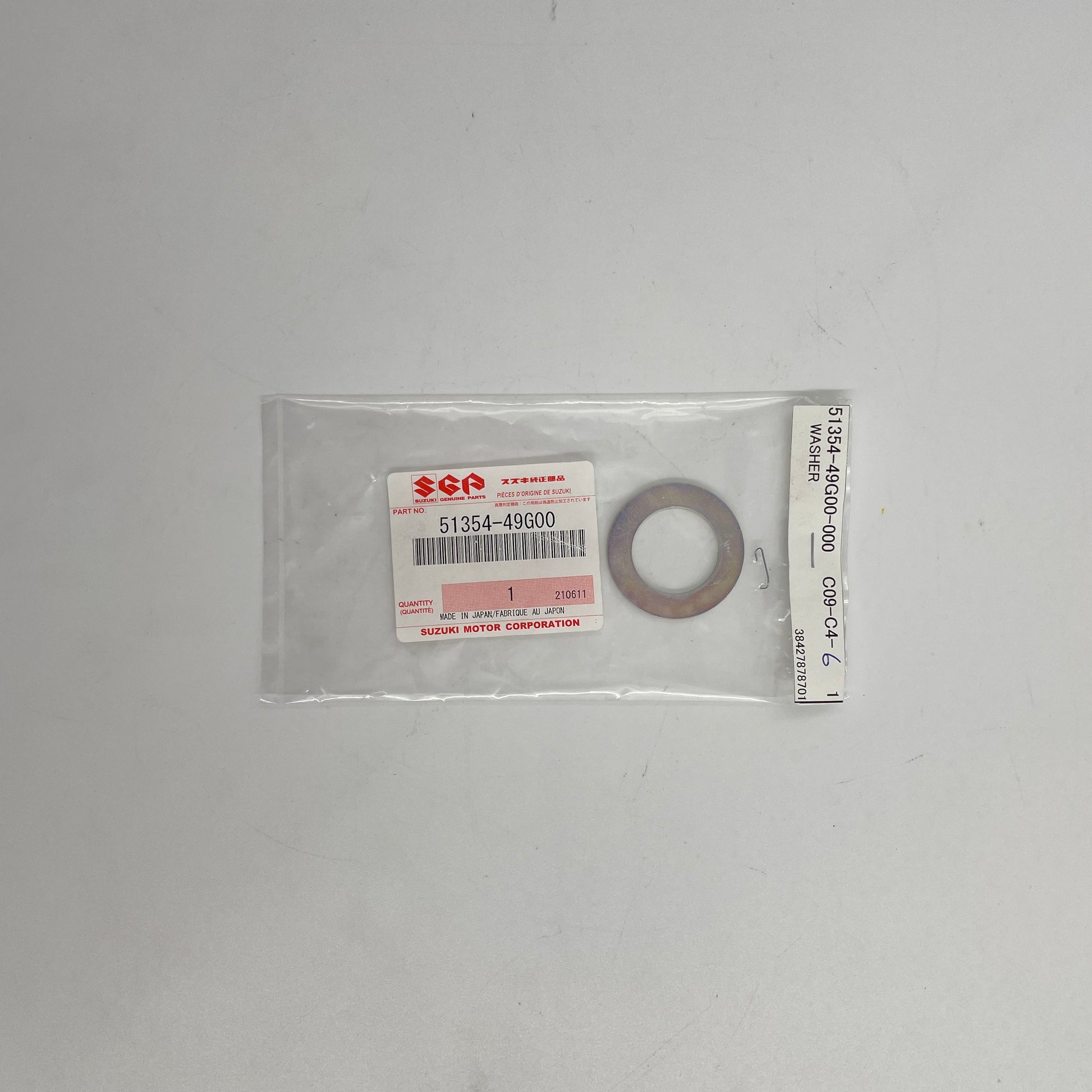 Suzuki washer in clear packaging on a white background