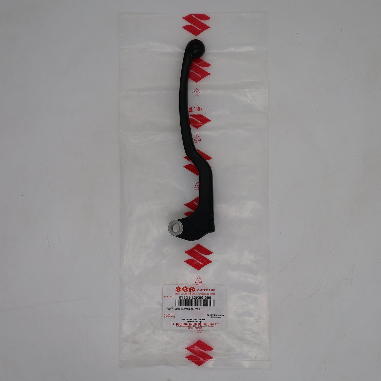 Black lever on a clear plastic bag with Suzuki branding