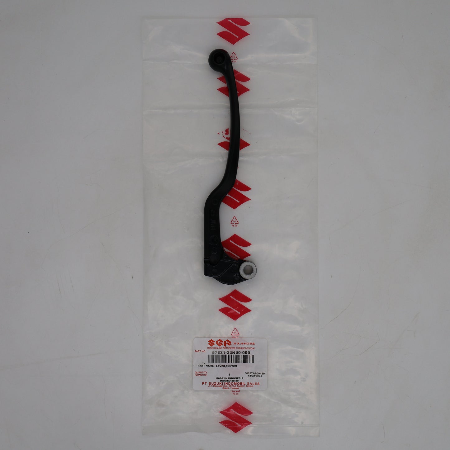 Black lever on a clear plastic bag with Suzuki logo