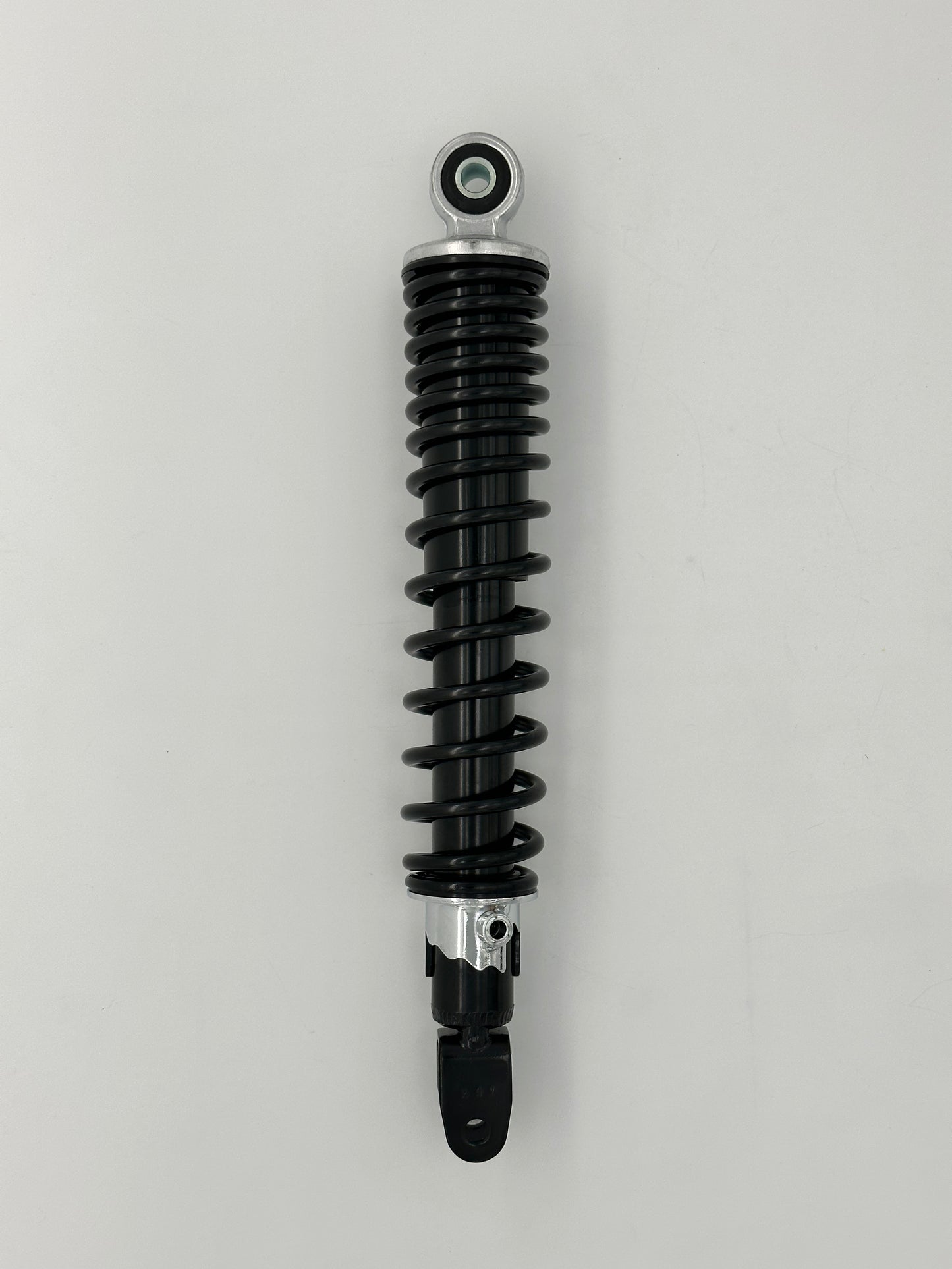 Black shock absorber on a gray background