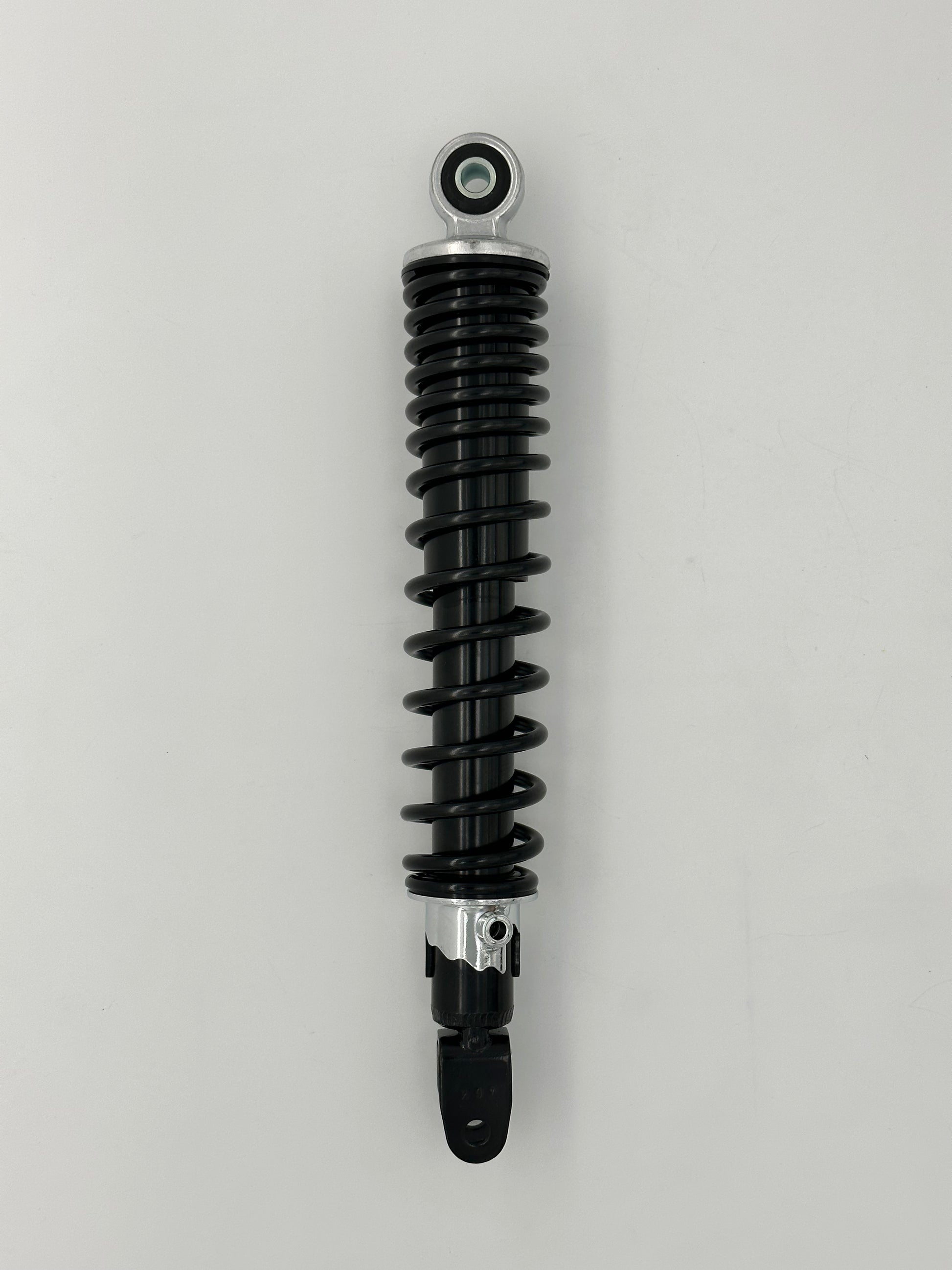 Black shock absorber on a gray background